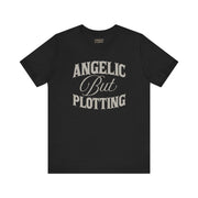 ANGELIC BUT PLOTTING TEE XS Black - Embrace The Chaos mental health humor apparel