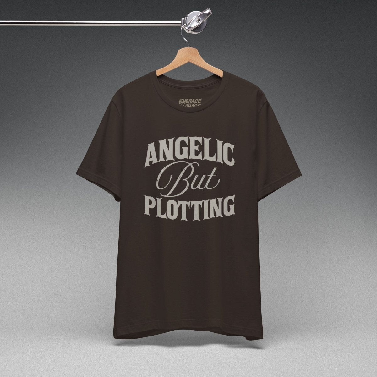 ANGELIC BUT PLOTTING TEE XS Brown - Embrace The Chaos mental health humor apparel