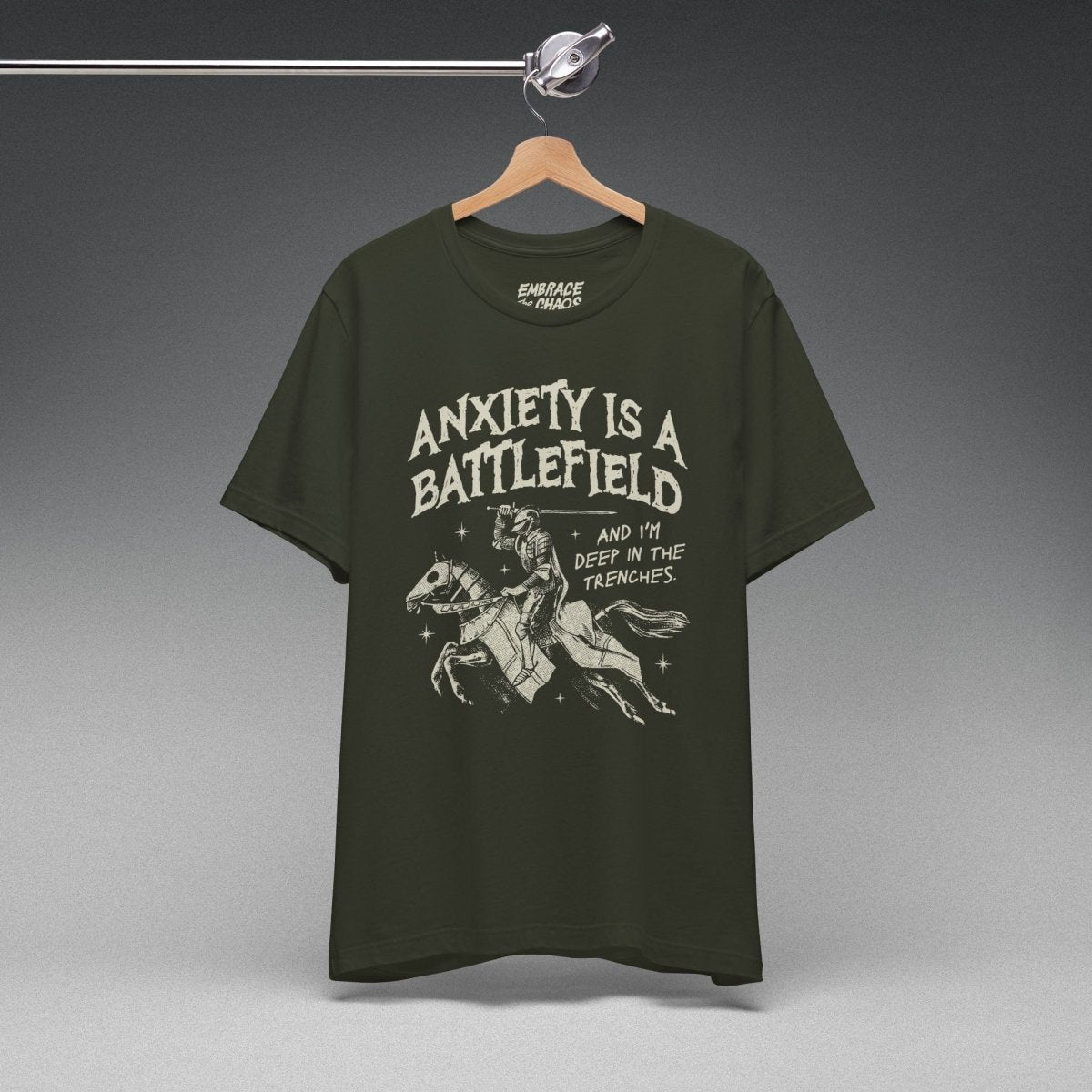 ANXIETY IS A BATTLEFIELD T-SHIRT XS Dark Olive - Embrace The Chaos mental health humor apparel
