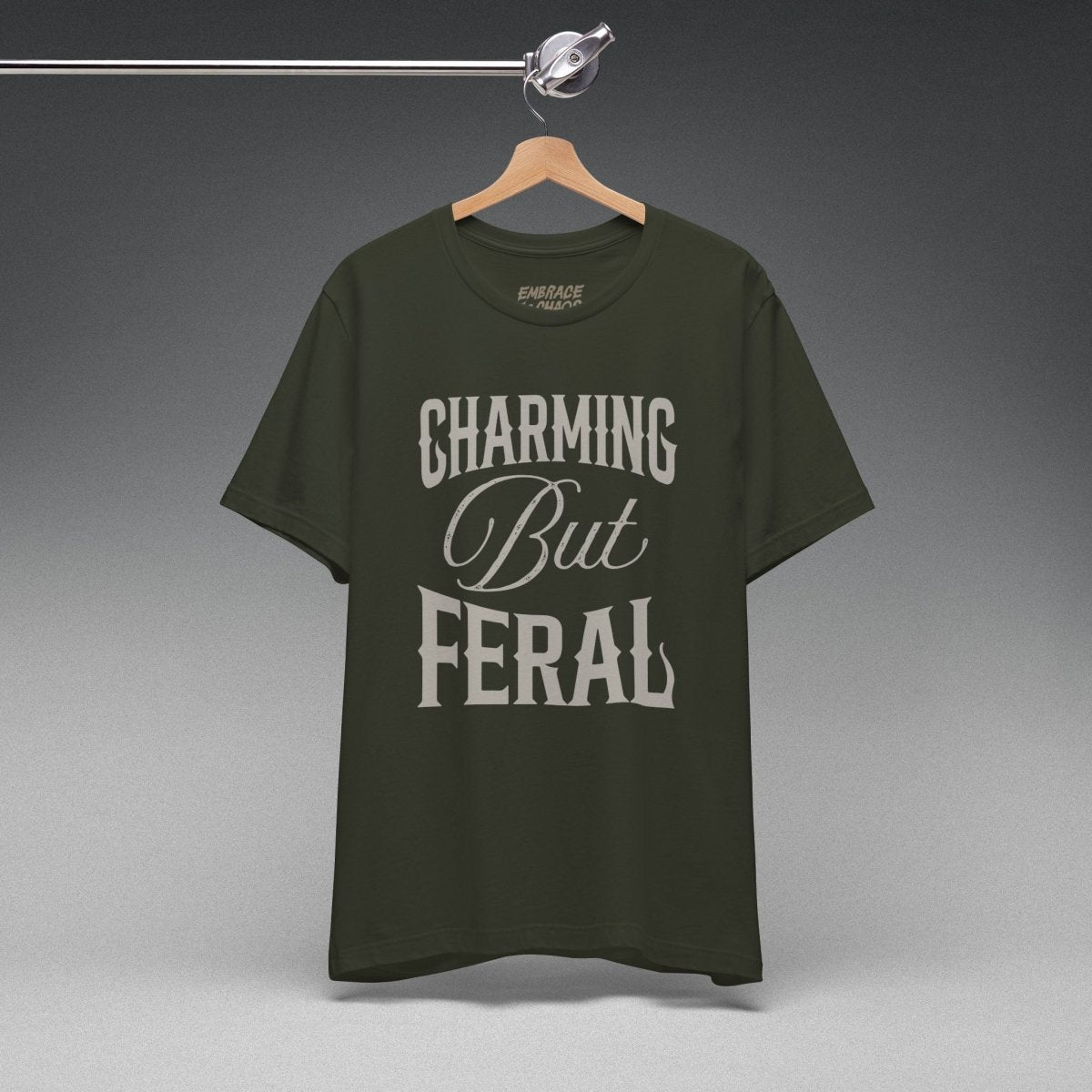CHARMING BUT FERAL TEE XS Dark Olive - Embrace The Chaos mental health humor apparel