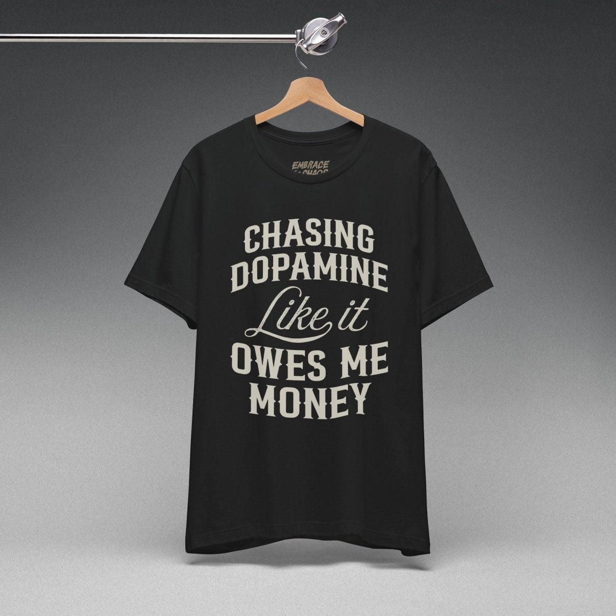 CHASING DOPAMINE LIKE IT OWES ME MONEY TEE XS Team Purple - Embrace The Chaos mental health humor apparel