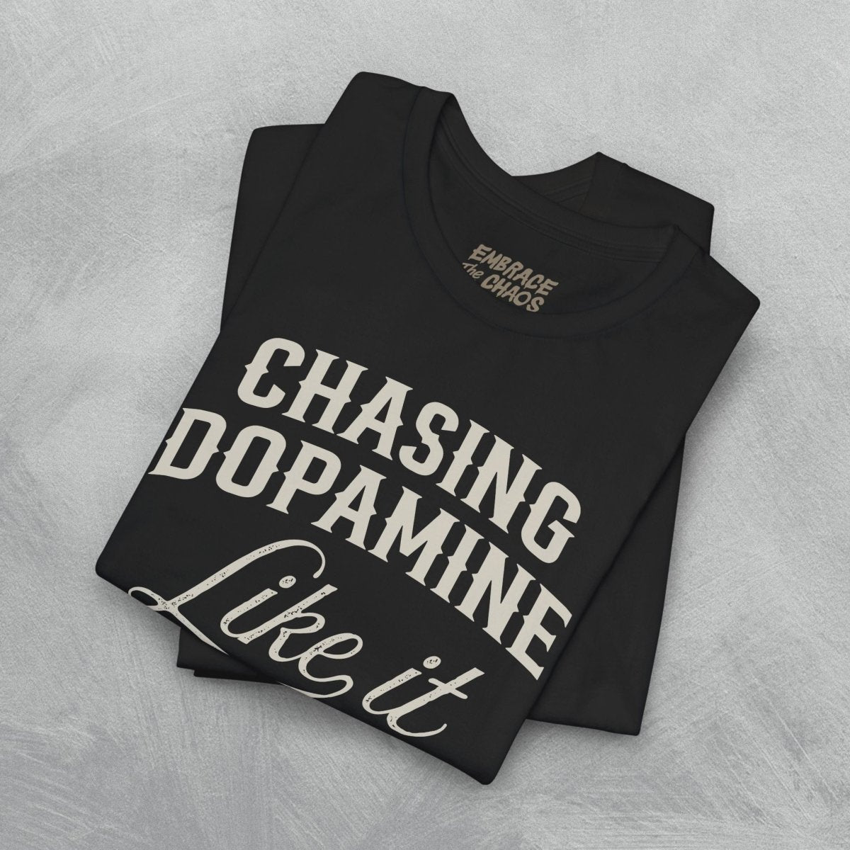 CHASING DOPAMINE LIKE IT OWES ME MONEY TEE XS Team Purple - Embrace The Chaos mental health humor apparel