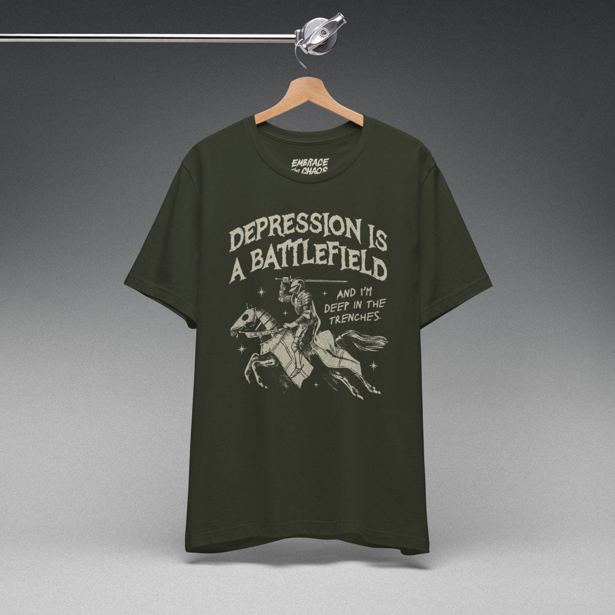 DEPRESSION IS A BATTLEFIELD T-SHIRT XS Dark Olive - Embrace The Chaos mental health humor apparel