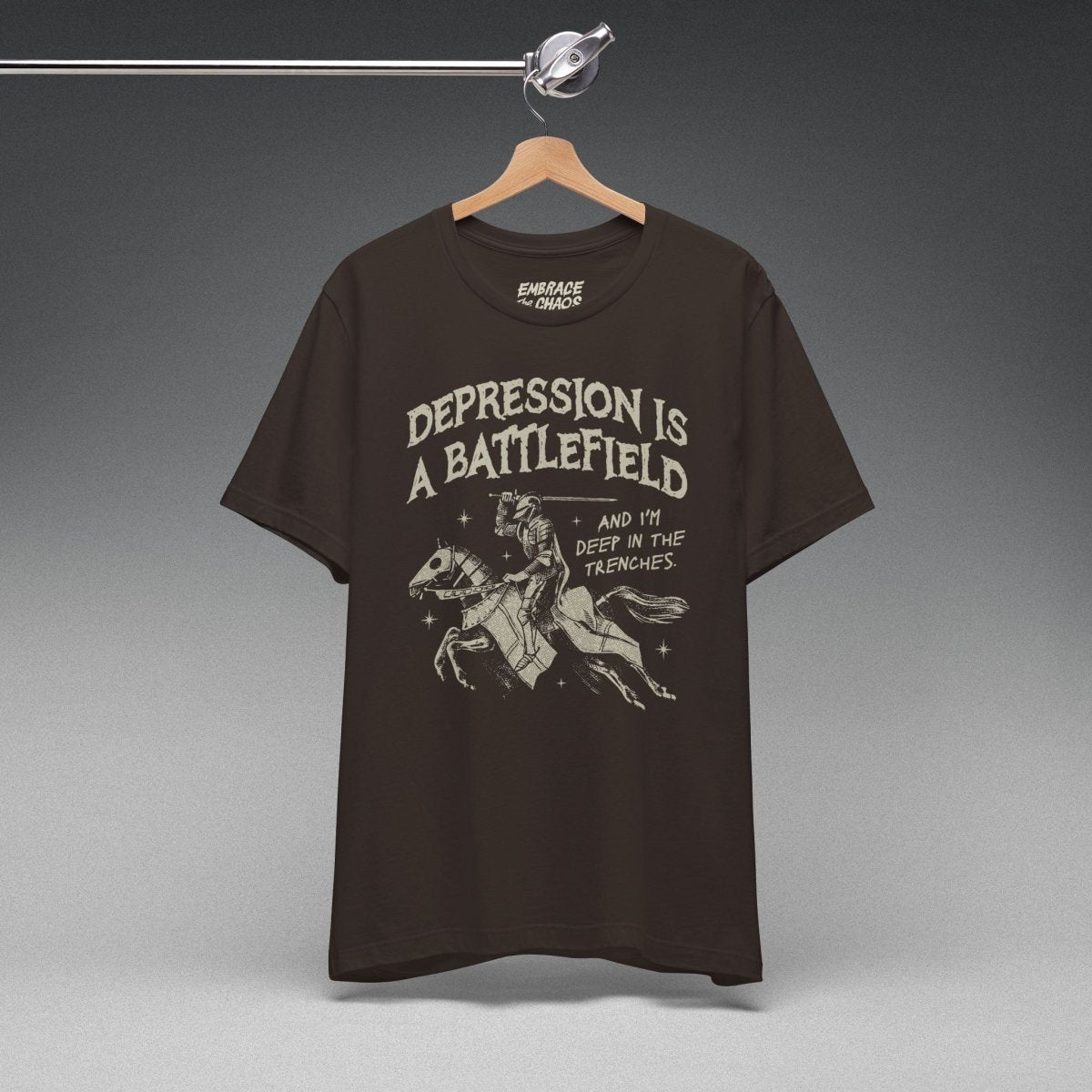 DEPRESSION IS A BATTLEFIELD T-SHIRT XS Brown - Embrace The Chaos mental health humor apparel