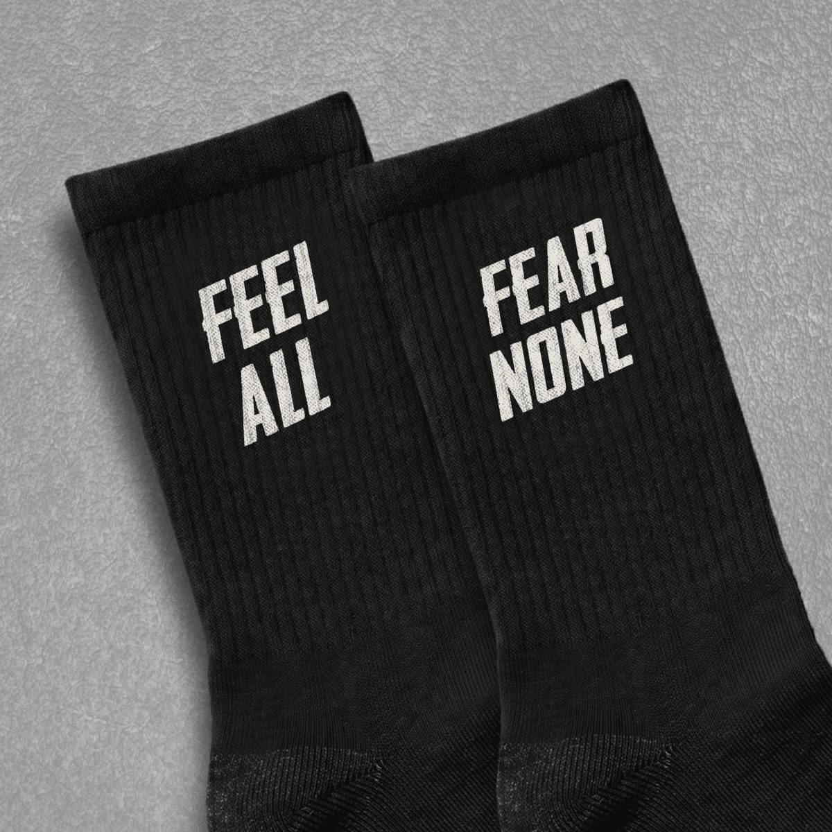FEEL ALL. FEAR NONE. UNISEX SOCKS One size White - Embrace The Chaos mental health humor apparel