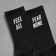 FEEL ALL. FEAR NONE. UNISEX SOCKS One size White - Embrace The Chaos mental health humor apparel