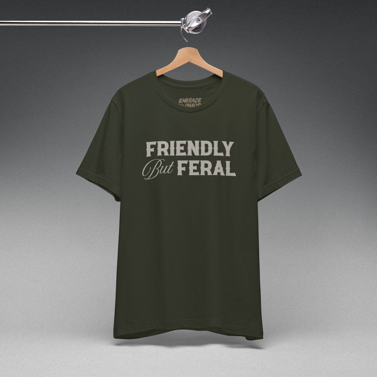 FRIENDLY BUT FERAL TEE XS Dark Olive - Embrace The Chaos mental health humor apparel
