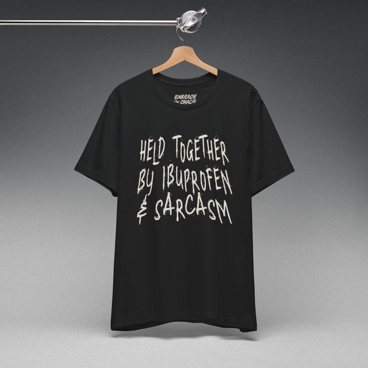 HELD TOGETHER BY IBUPROFEN & SARCASM TEE XS Army - Embrace The Chaos mental health humor apparel