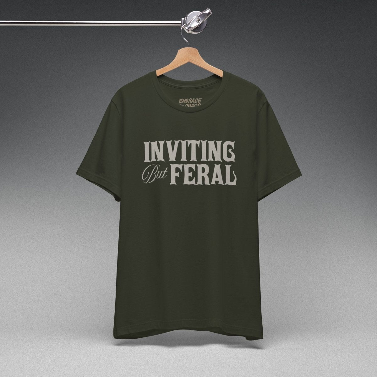 INVITING BUT FERAL TEE XS Dark Olive - Embrace The Chaos mental health humor apparel