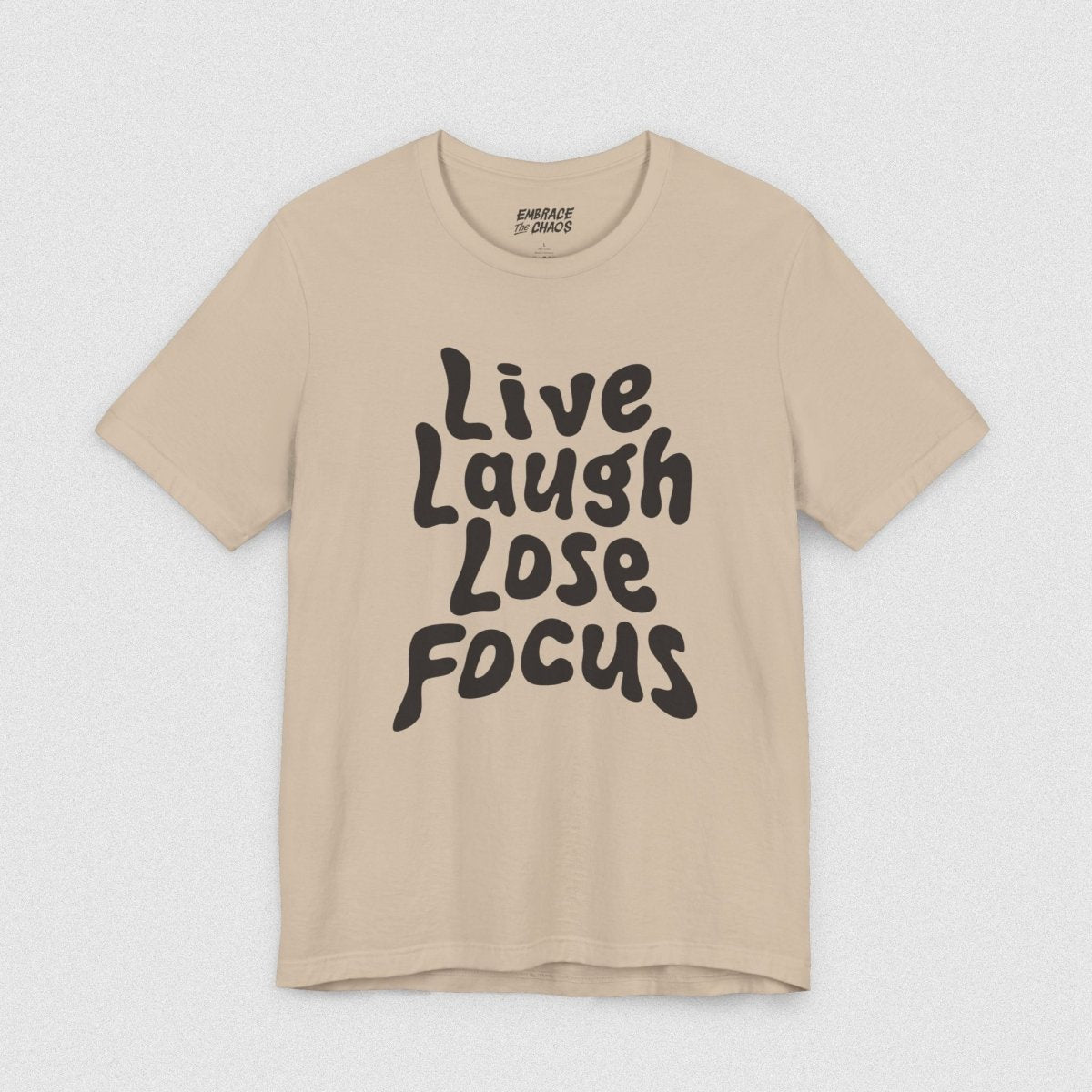 LIVE LAUGH LOSE FOCUS TEE XS Tan - Embrace The Chaos mental health humor apparel