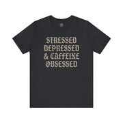 STRESSED DEPRESSED & CAFFEINE OBSESSED TEE XS Vintage Black - Embrace The Chaos mental health humor apparel