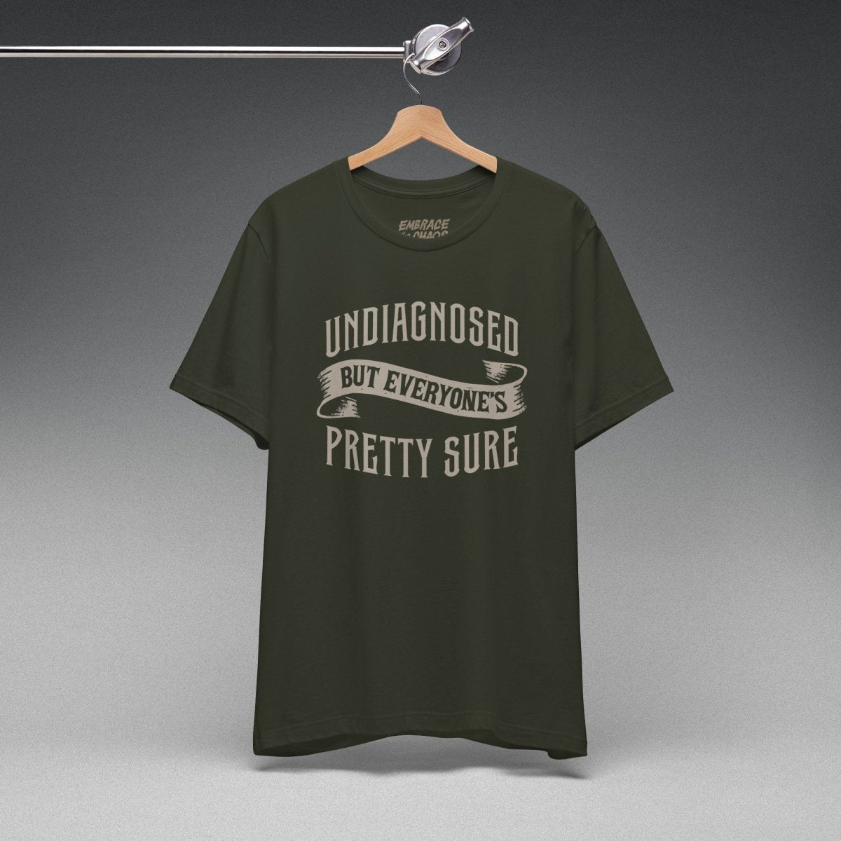 UNDIAGNOSED BUT EVERYONE'S PRETTY SURE TEE XS Dark Olive - Embrace The Chaos mental health humor apparel